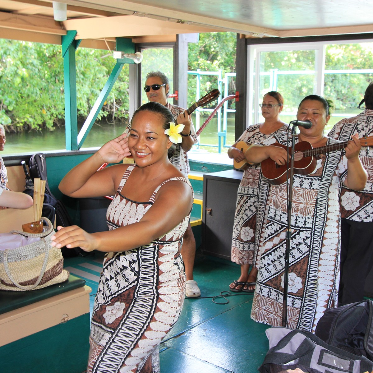 a group of people sitting at a table in front of a window