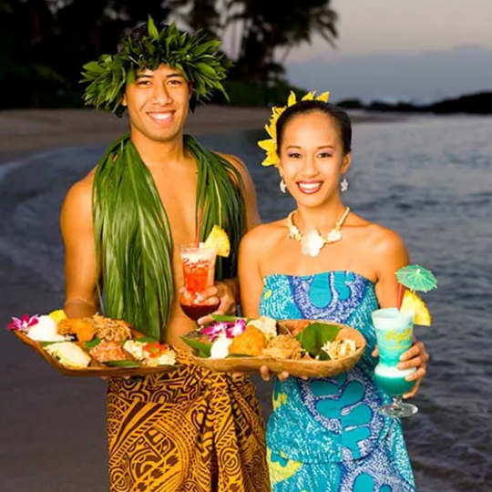 a person standing in front of a cake