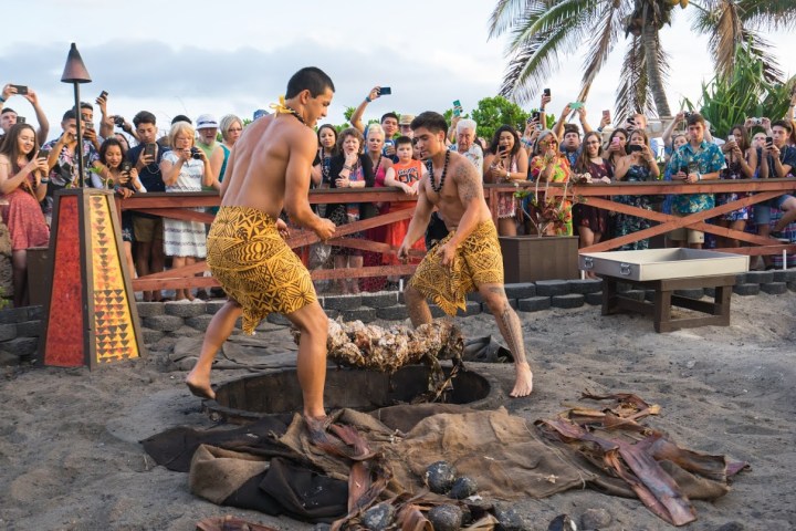 a group of people that are standing in the dirt