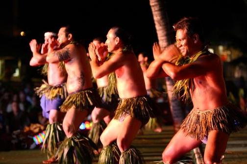 a group of people performing on stage in front of a crowd